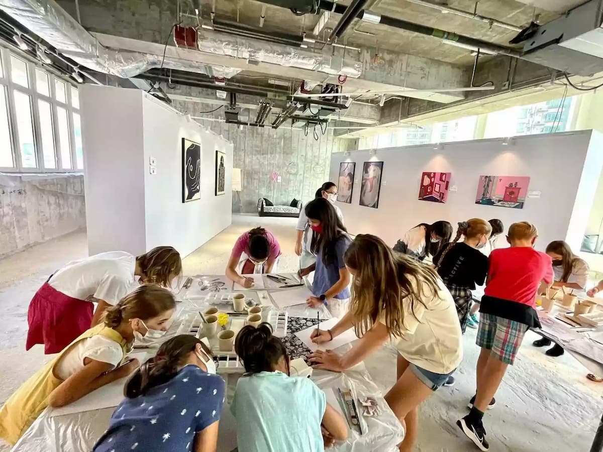 people doing pottery painting class