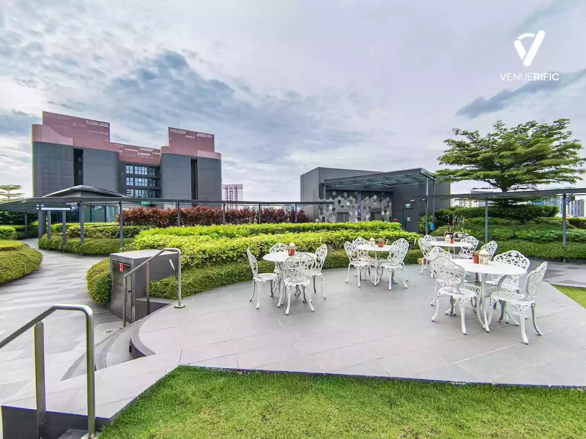 Club Di Lusso outdoor dining area with white victorian chairs