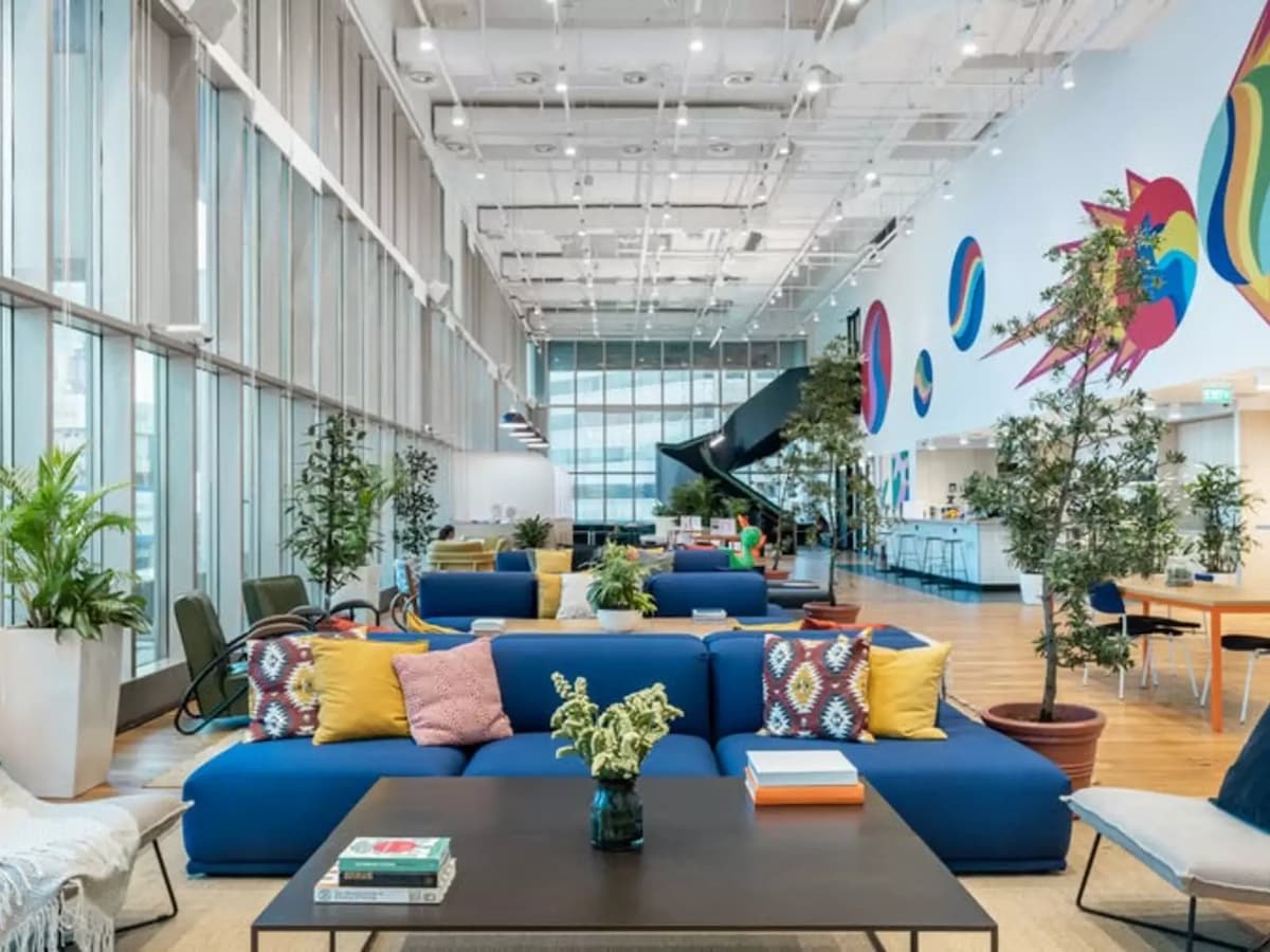 networking venues singapore with blue sofas, patterned pillows, and colorful walls