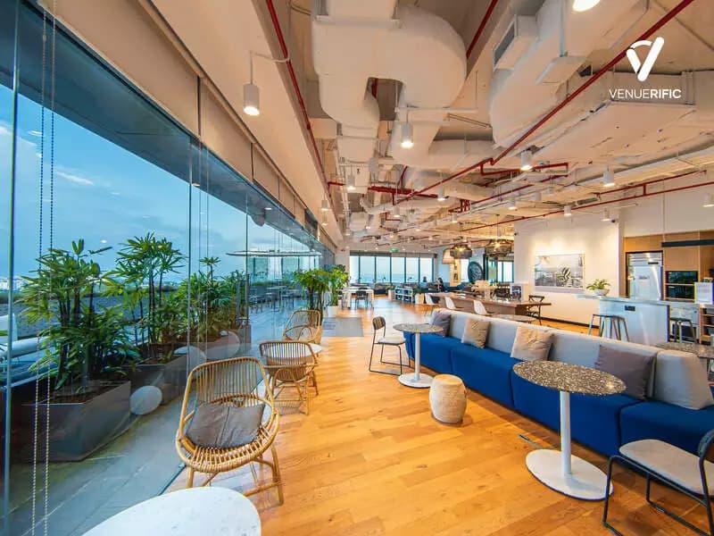 meeting venue with coworking space with rattan furniture by the window overlooking the city