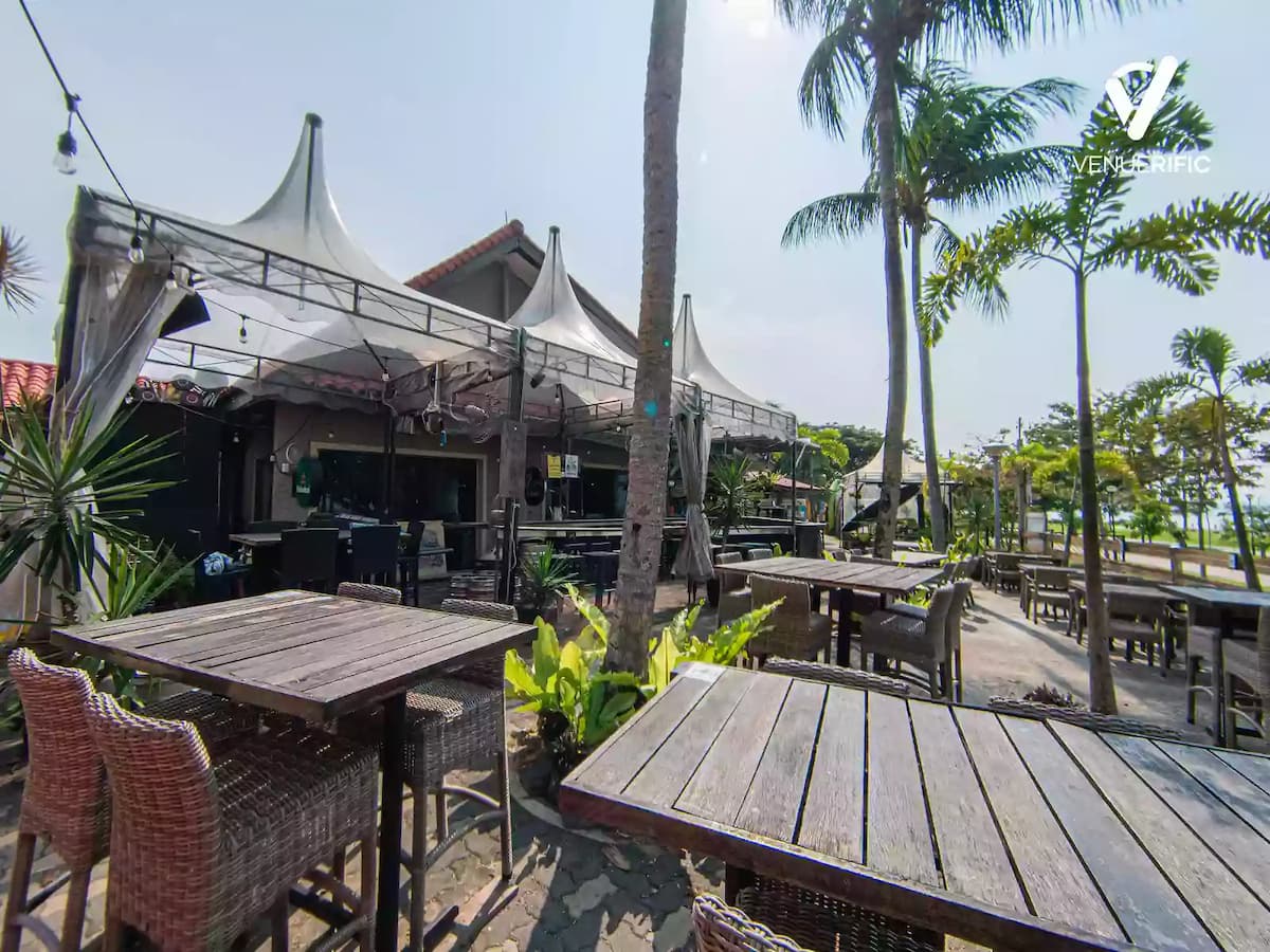 beach front restaurant with tables and chairs