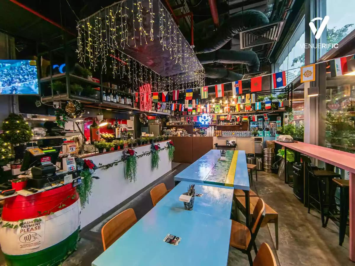 long table with wooden chairs and a bar area