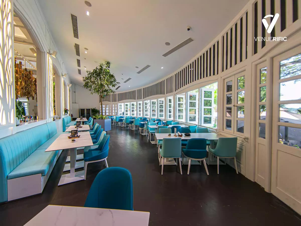 indoor restaurant with blue and white tables and chairs