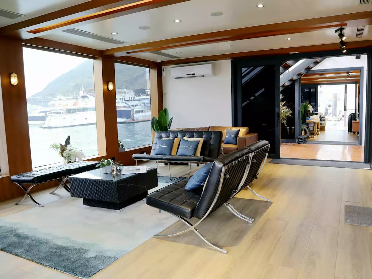 the floor to ceiling windows and glass ceiling of yacht indoor area