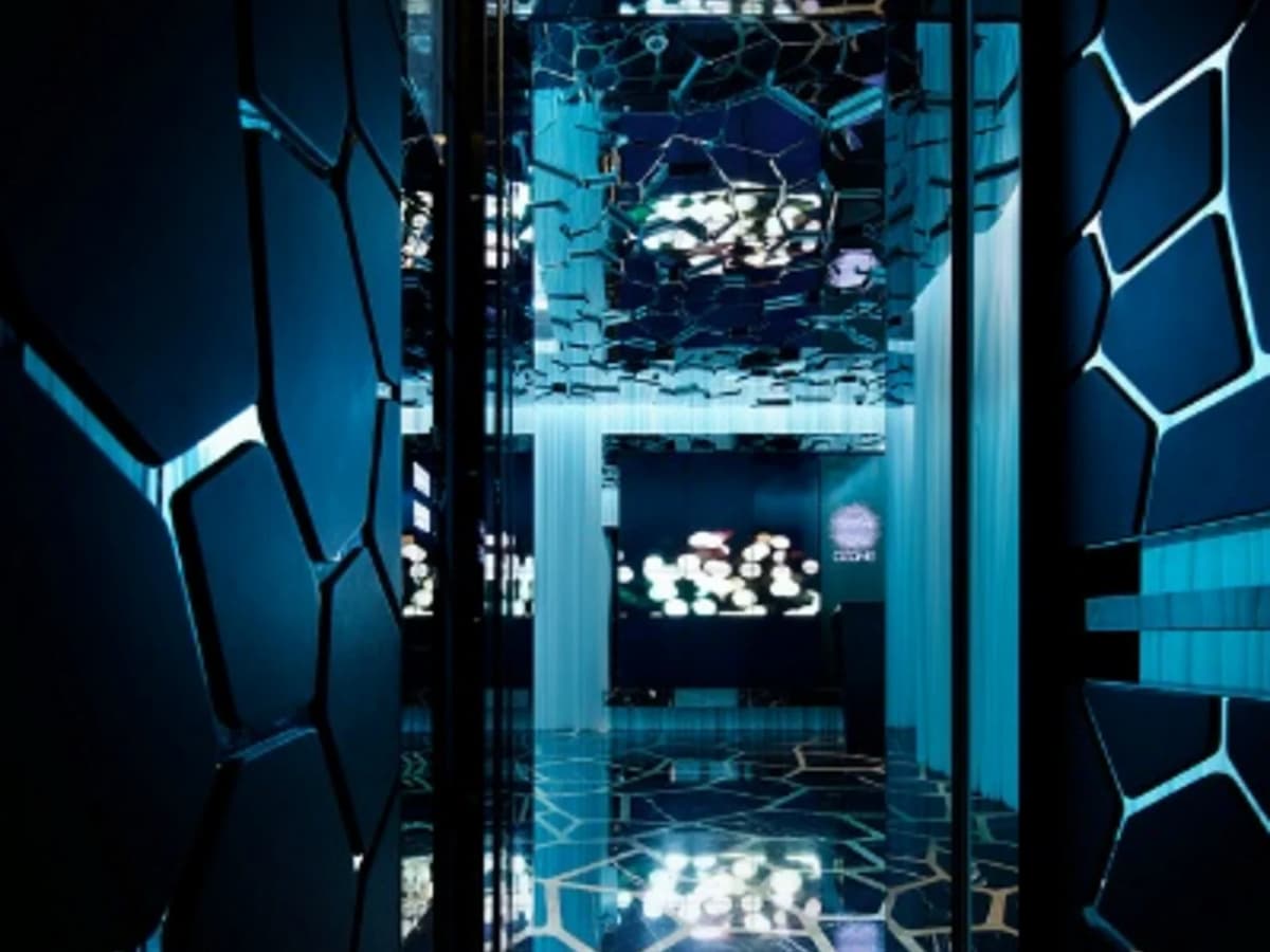 walkway in bar with honeycomb wall art