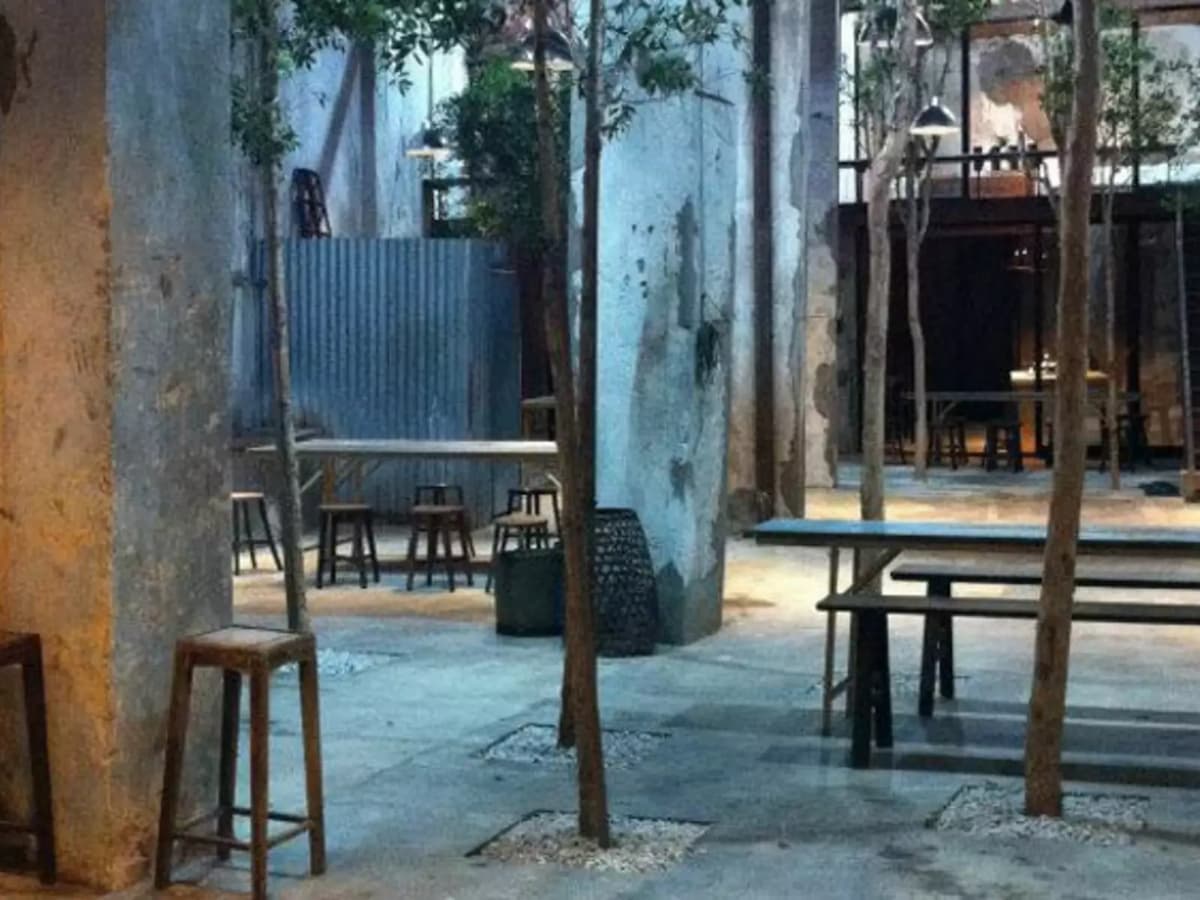 casual meeting space in penang with outdoor area and trees