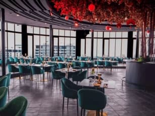 indoor restaurant with full glass windows and red lantern ceiling décor