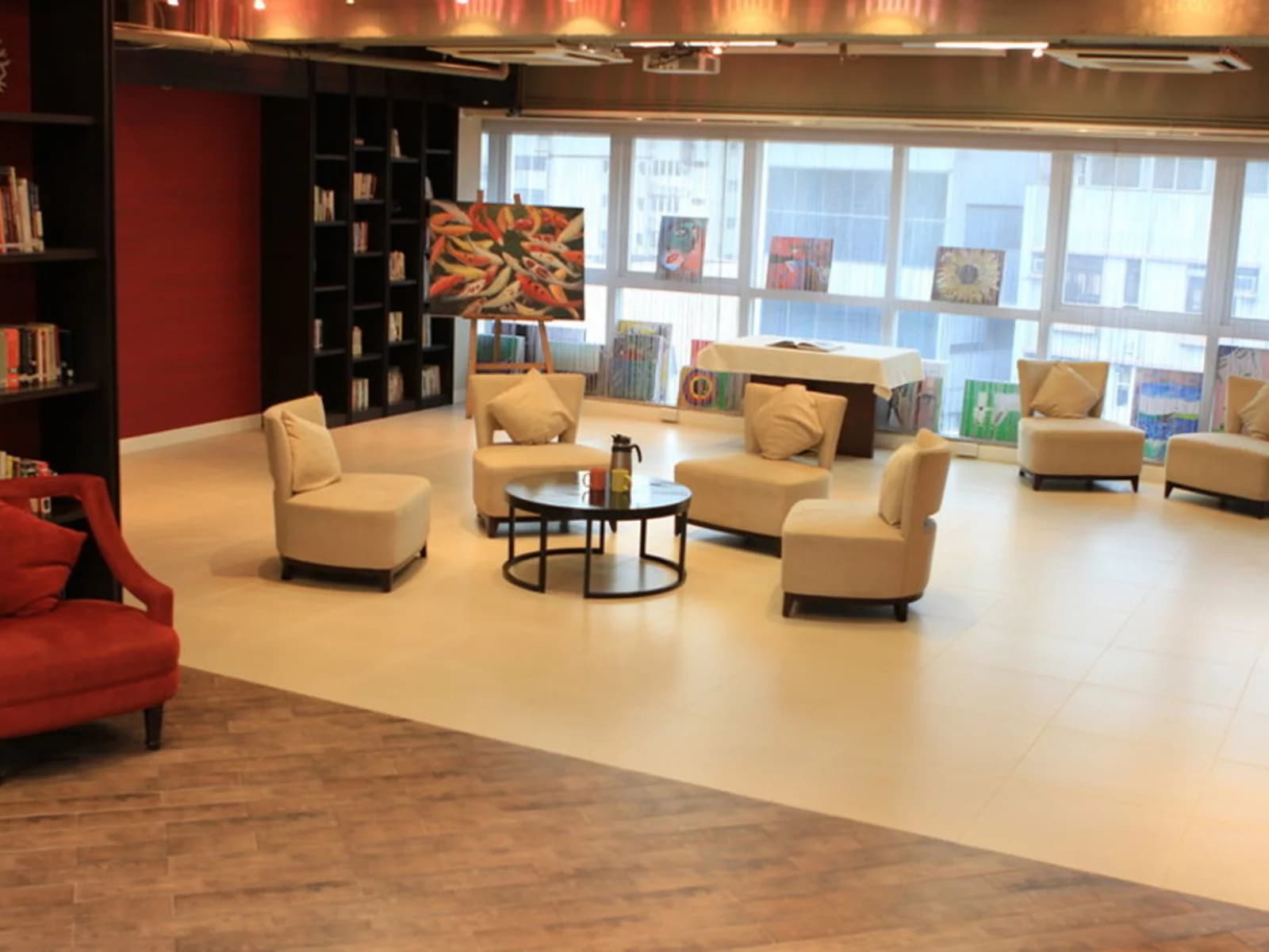 lounge area with multiple couches and glass window