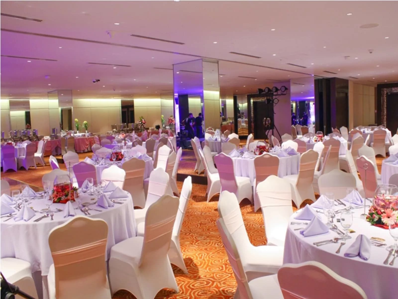 high ceiling ballroom in philippines with banquet seating and glass pillars