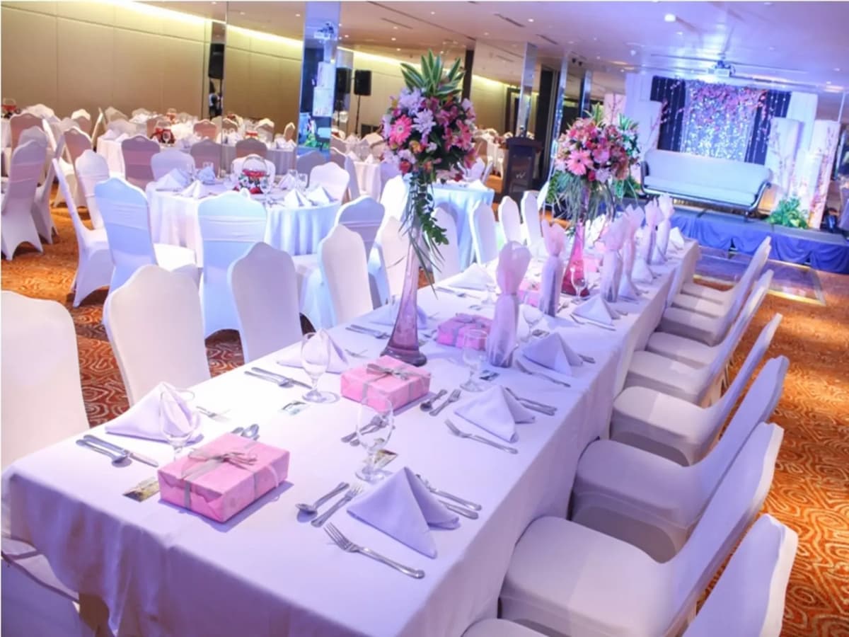 white long tables with flower decorations in manila birthday venue