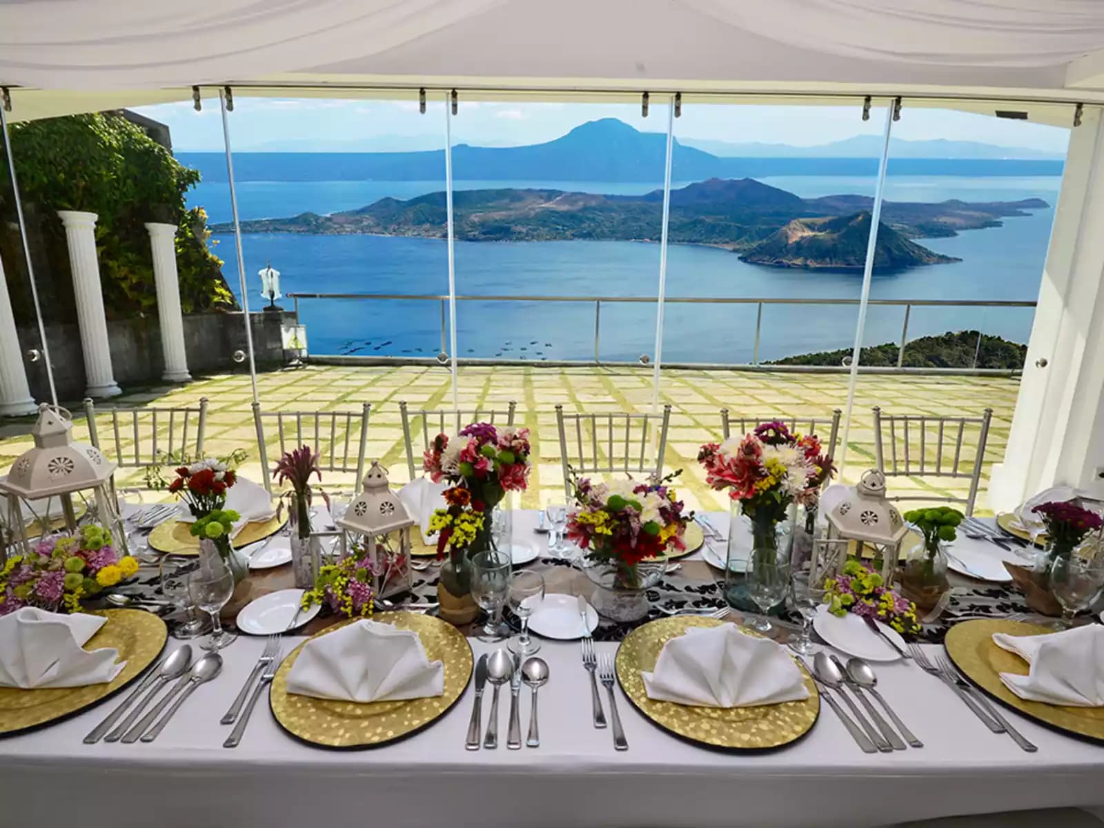 tagaytay event space with long white dining table and sea view