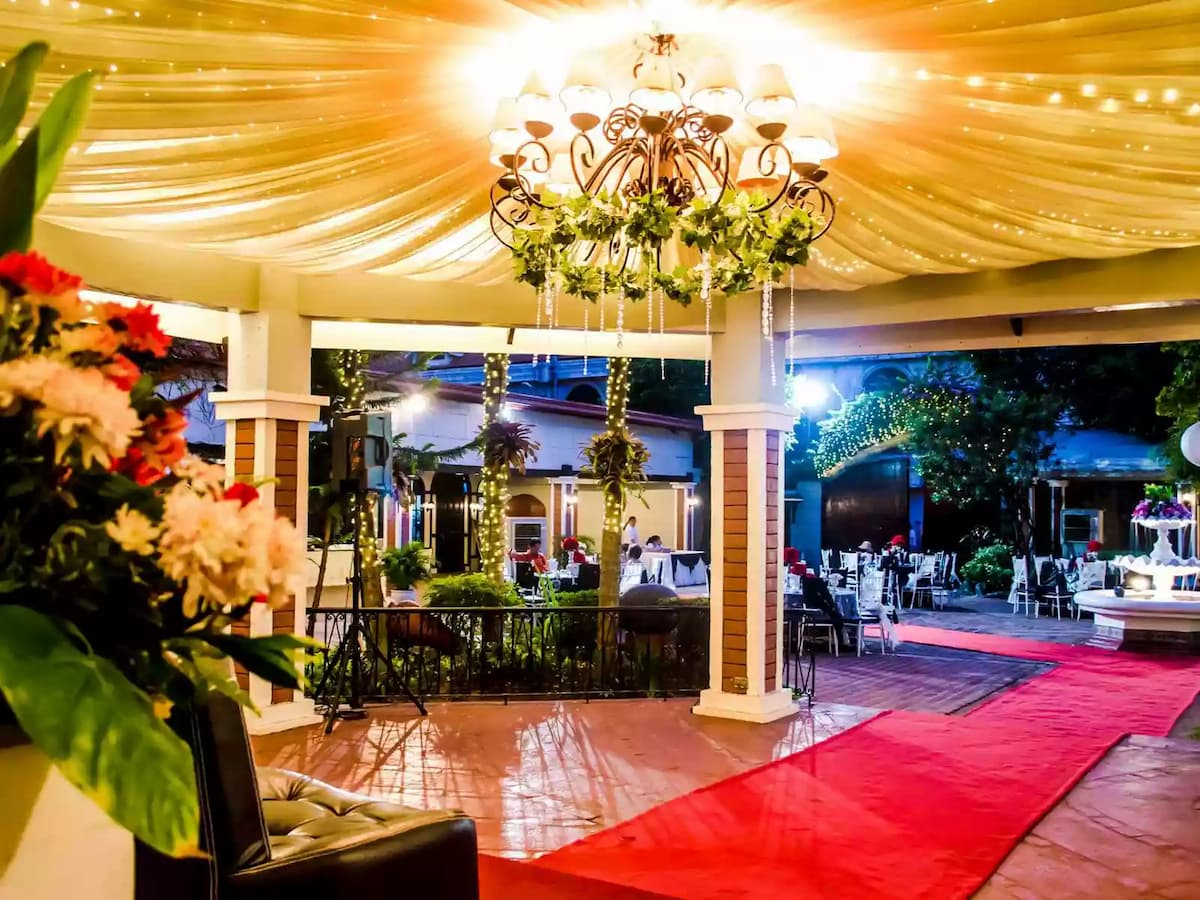 red carpet leading to the entrance of wedding space
