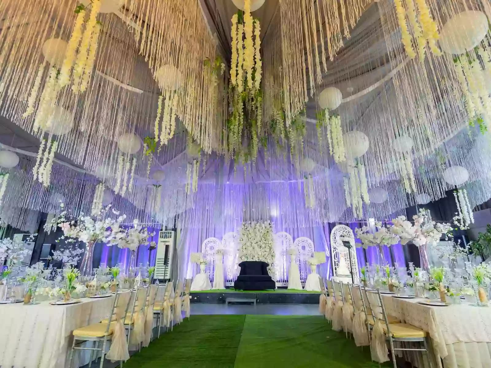 wedding ballroom with ceiling draping and long table setup caloocan