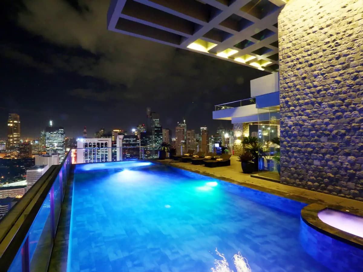 rooftop swimming pool with panoramic city view
