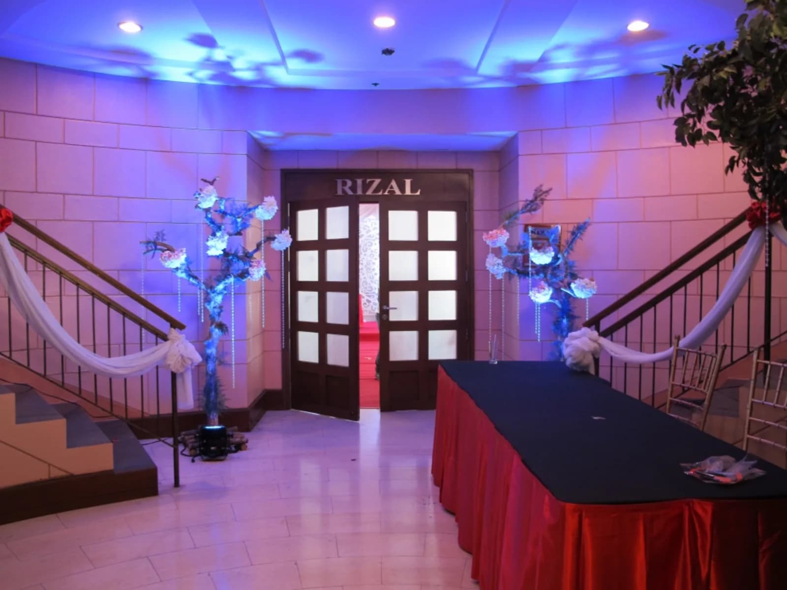manila christmas party space with stairs and long table at the entrance