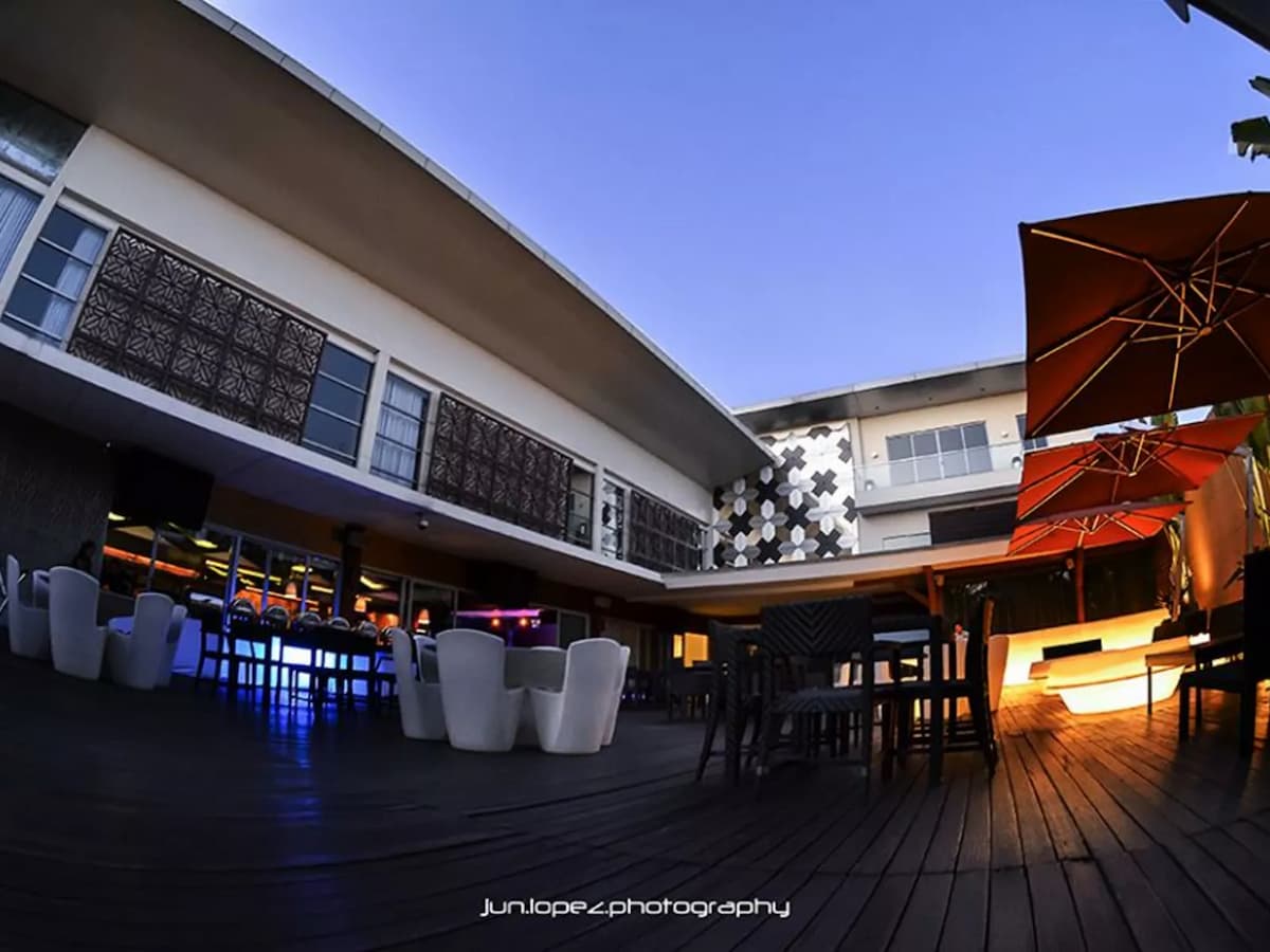 rooftop event space with table chairs setup for private party venue quezon city