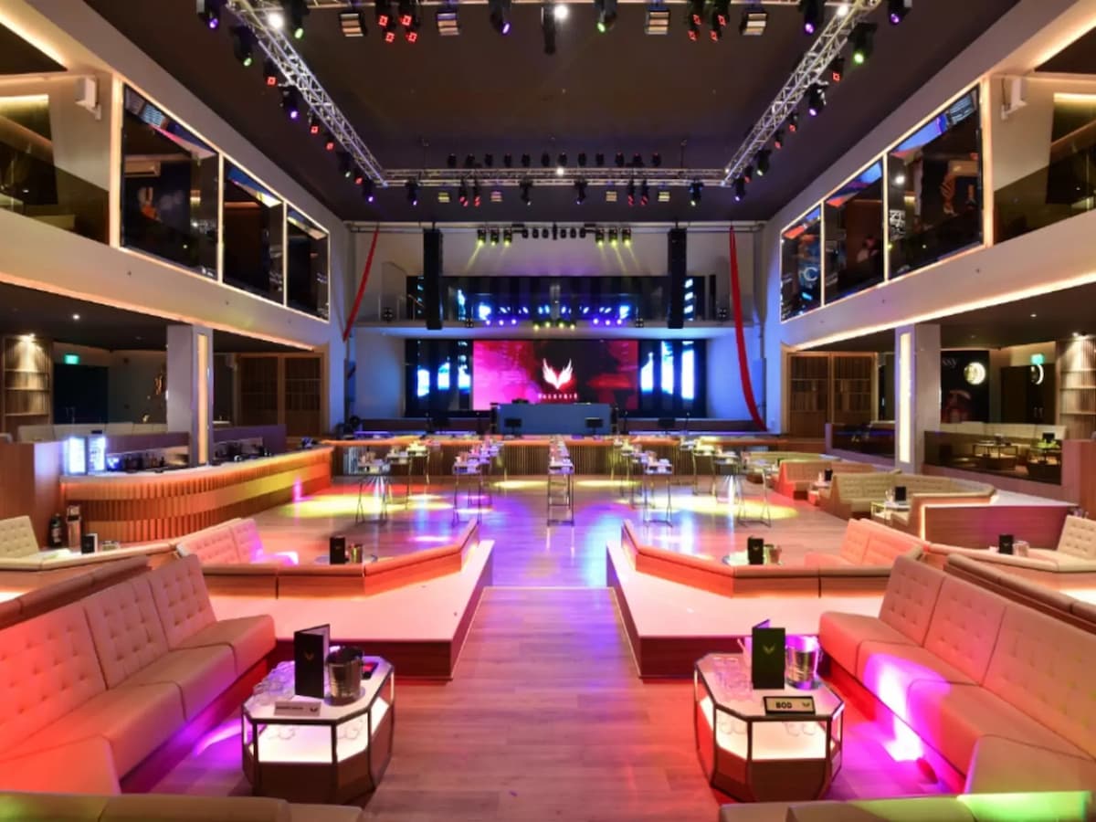 high ceiling bachelor party event venue in philippines with several long couches and track lights