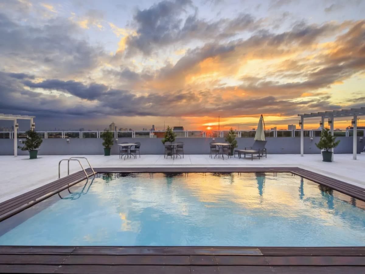 swimming pool overseeing sunset quezon city