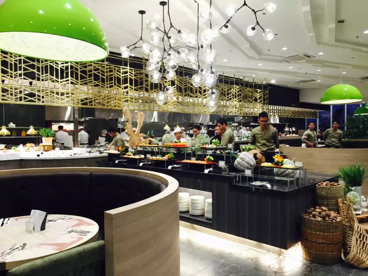 large birthday venue in paranaque with black buffet table and green pendant lamps