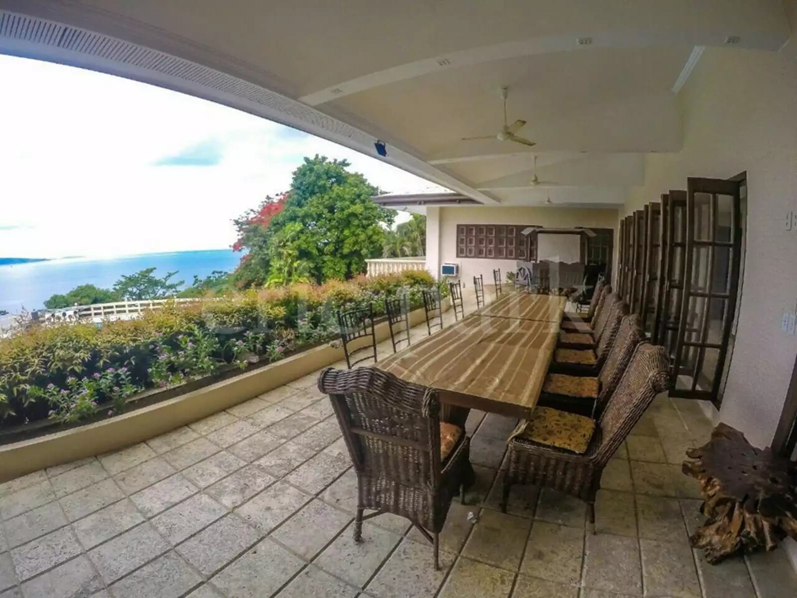 balcony with dining table in tali beach house