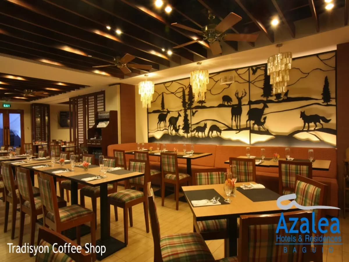 coffee shop with large animal paint on the wall
