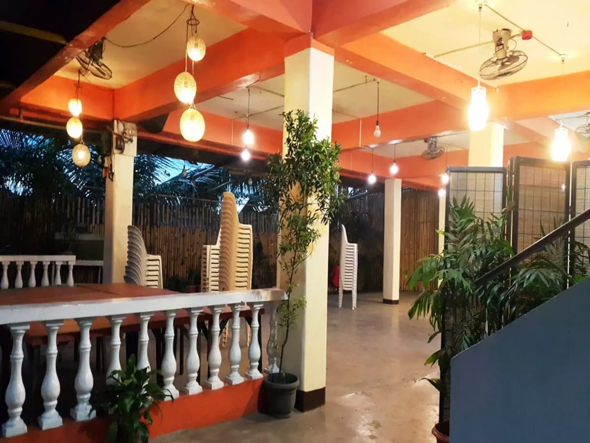 indoor wedding space in navotas with several pillars and plants around event space manila