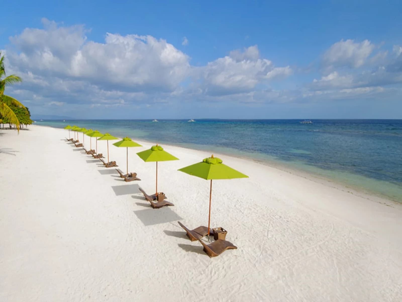 lounge chairs by beachside hotel bohol