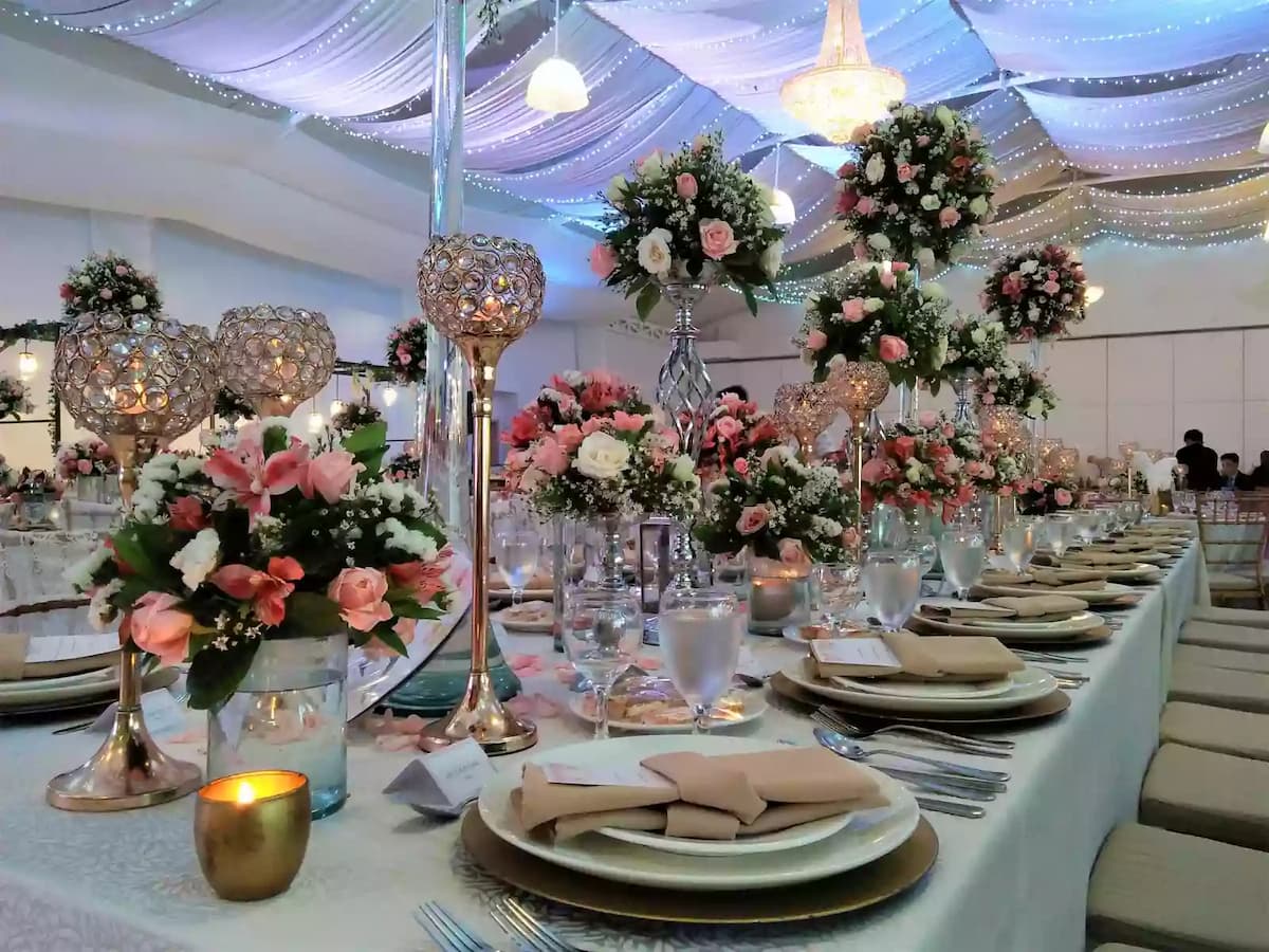 wedding dinner table decoration with high flower vase event space quezon city