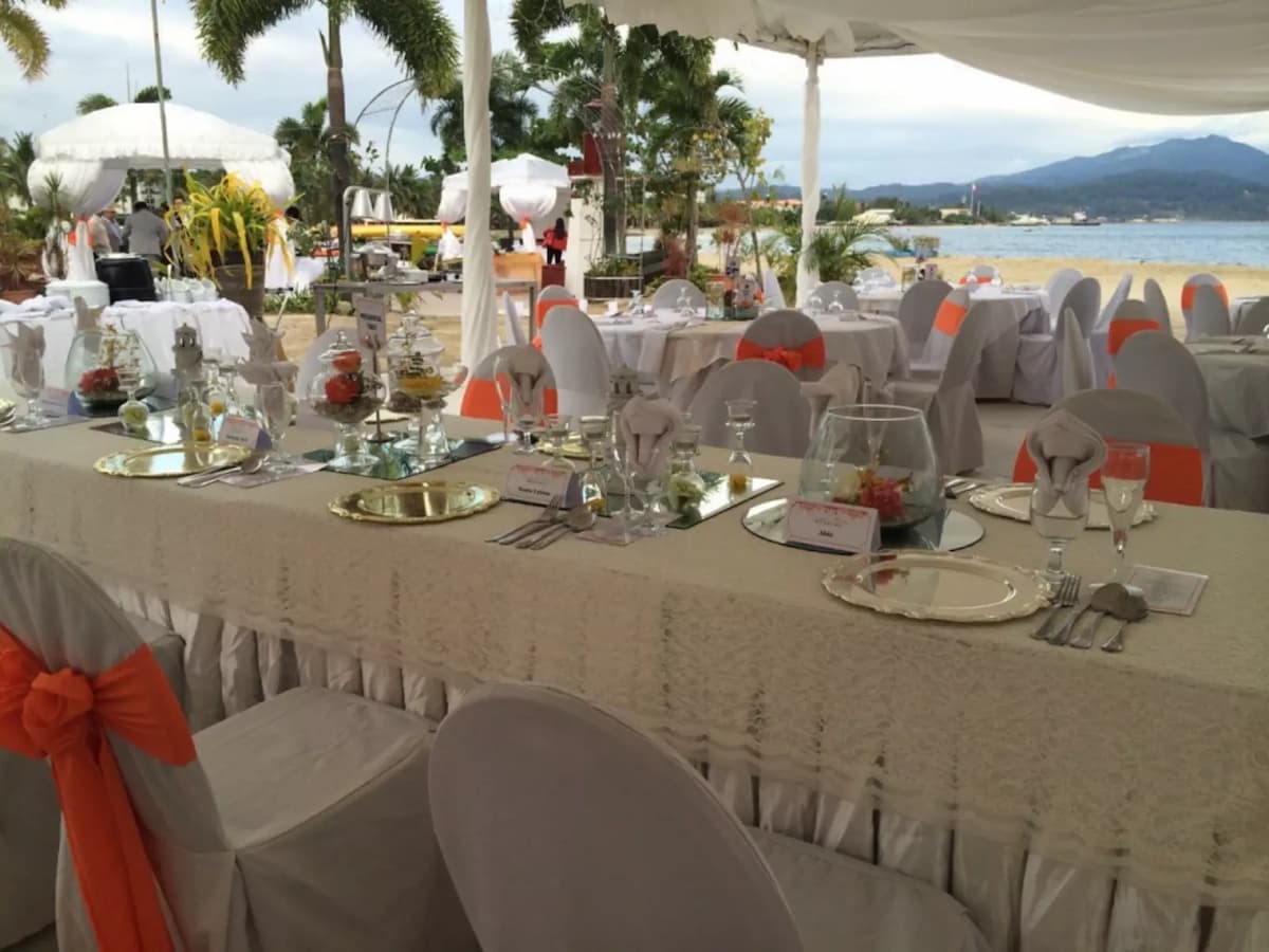 long dining table in philippines corporate event space with sea view
