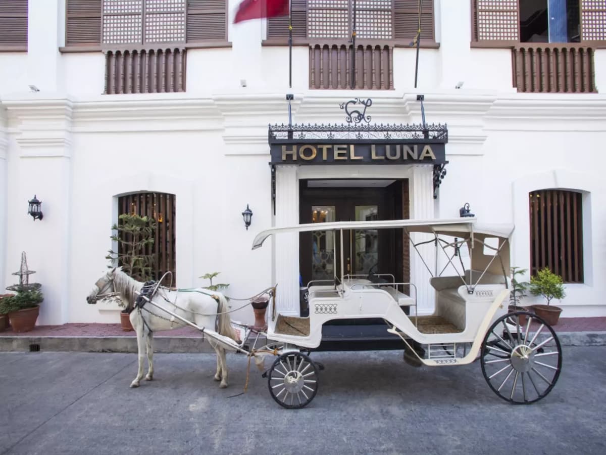 the exterior look of hotel luna featuring horse carriage hotel ilocos sur