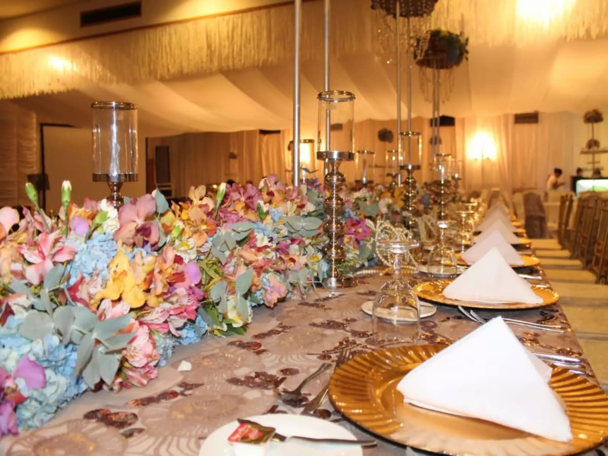 anniversary party venue in davao city with long table set up and flower decorations