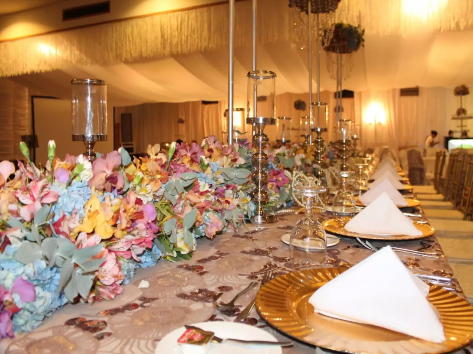 anniversary party venue in davao city with long table set up and flower decorations