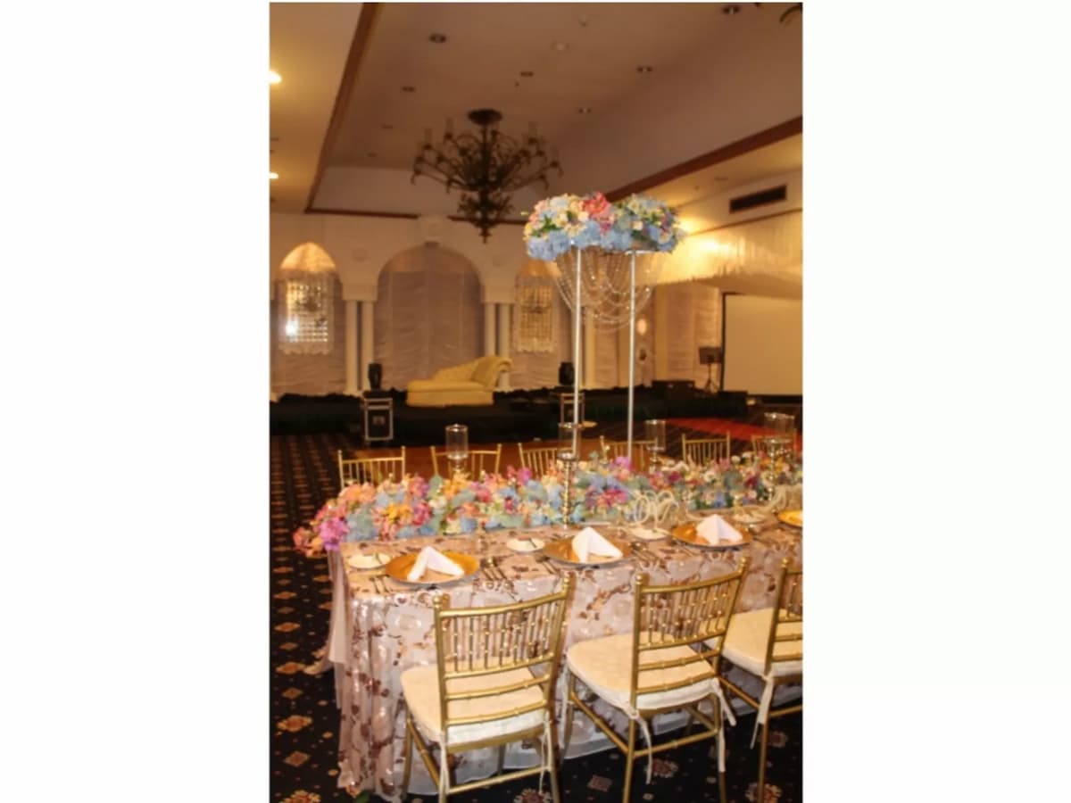 large wedding hall in davao city with standing flower decorations and mini stage