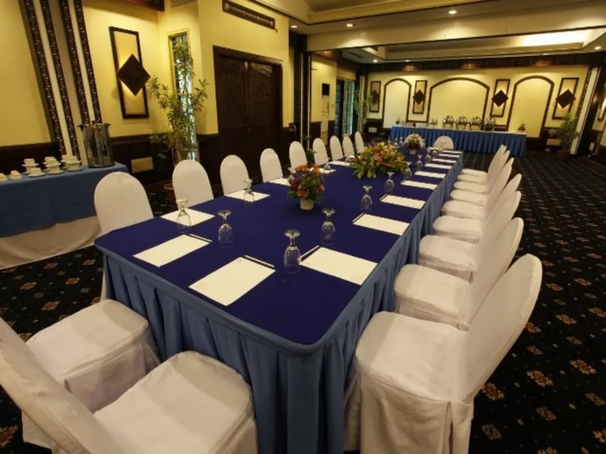 davao city private meeting space with long blue table and white audience chairs