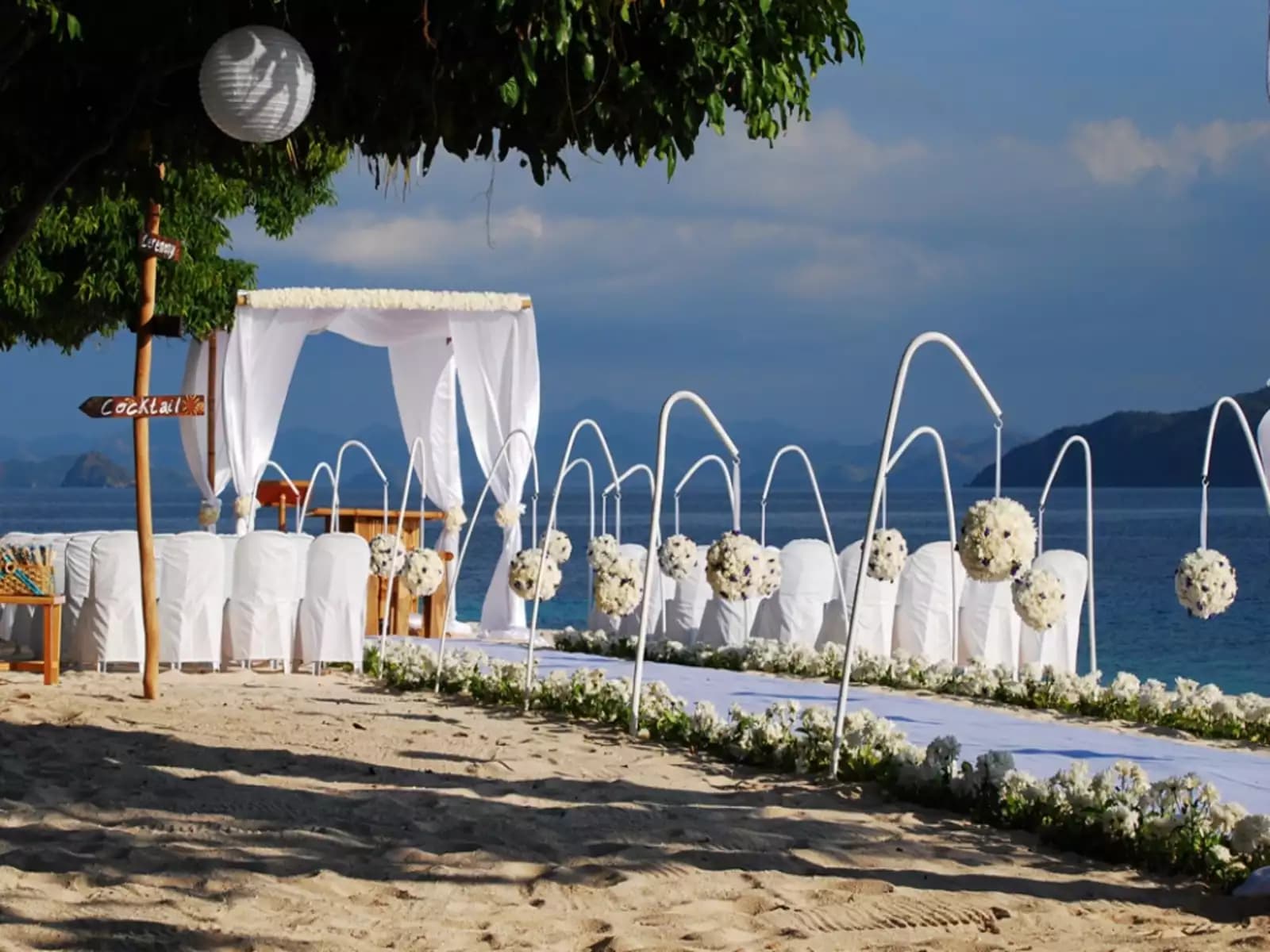 white wedding reception at the beachfront hotel palawan