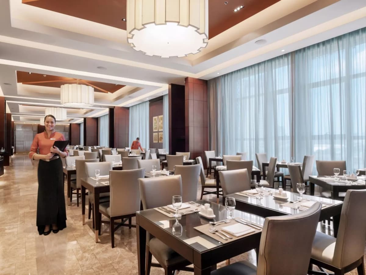 main dining restaurant area with floor to ceiling window hotel alabang