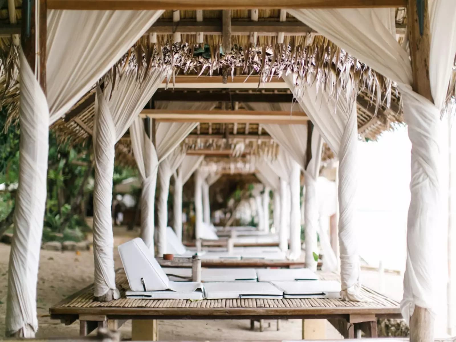 huts decorated with white cloth beach resort batangas