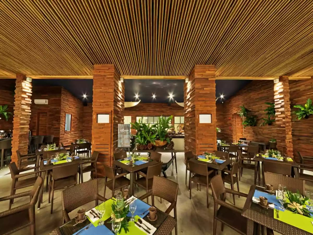 main restaurant area dominated with brick and wooden interior event space palawan