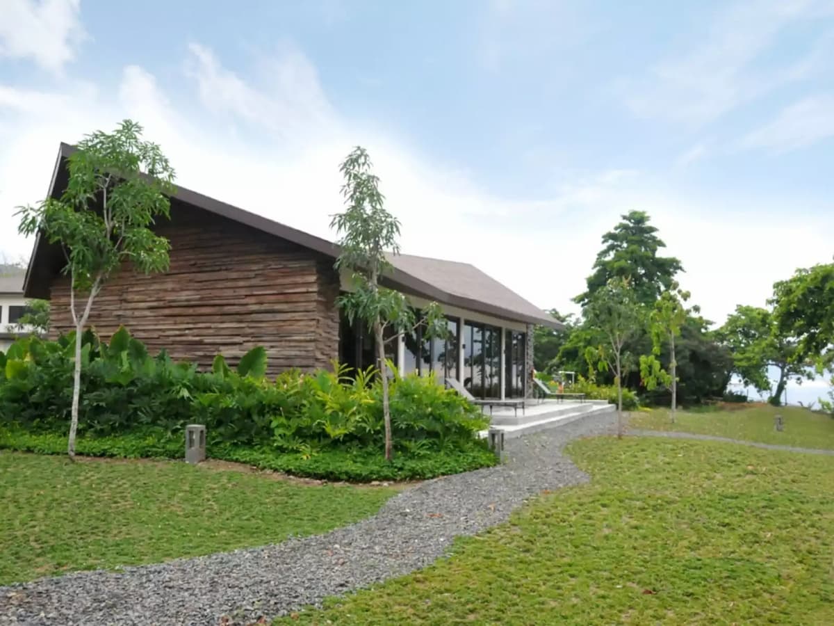 the exterior building of astoria palawan surrounded with green environment