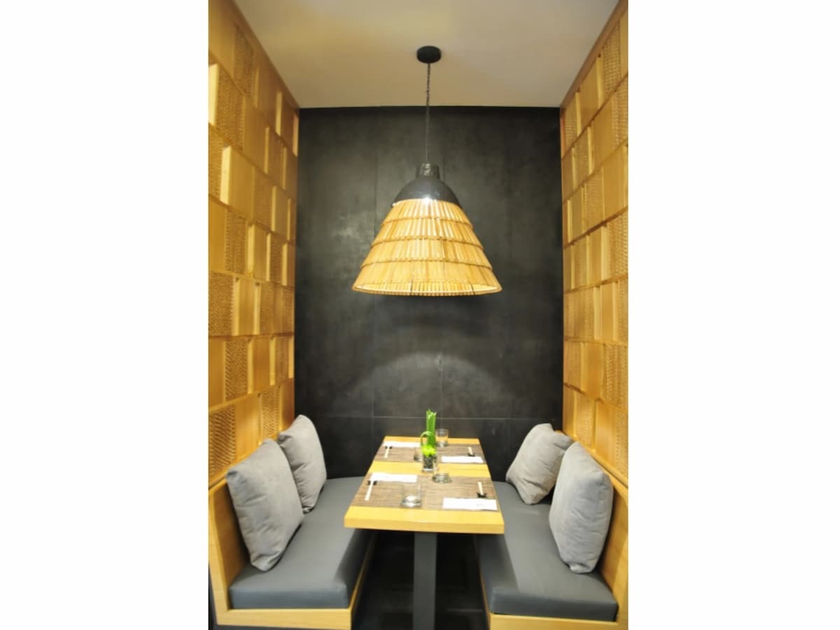 dining seats with rattan chandelier and wall restaurant pasig