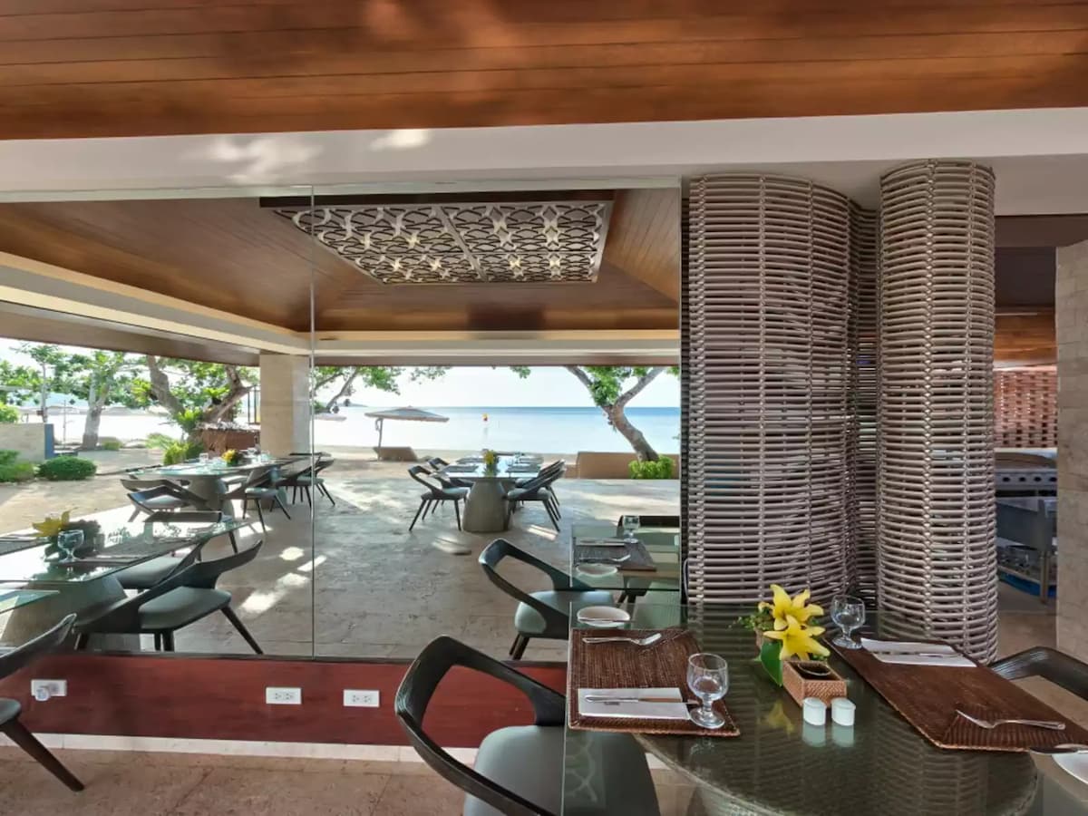 semi outdoor restaurant with the view of the beach and sea hotel bohol