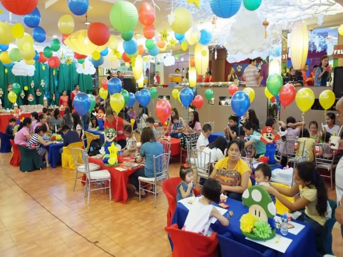 families with kids gathering in different tables during birthday party restaurant cebu