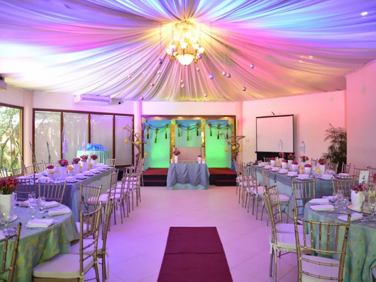medium solemnization venue with long dining tables and pendant lamps pasay