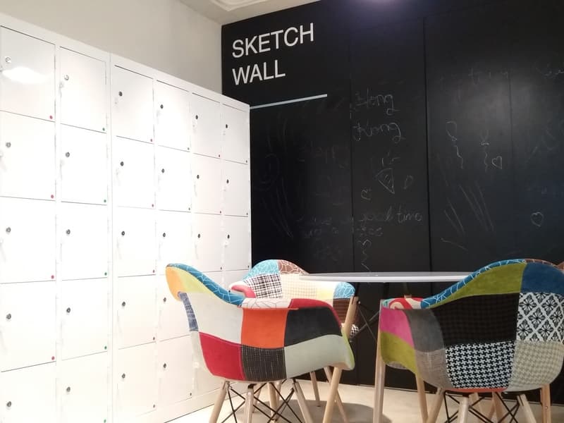 locker lounge area with colourdul checkboard chairs