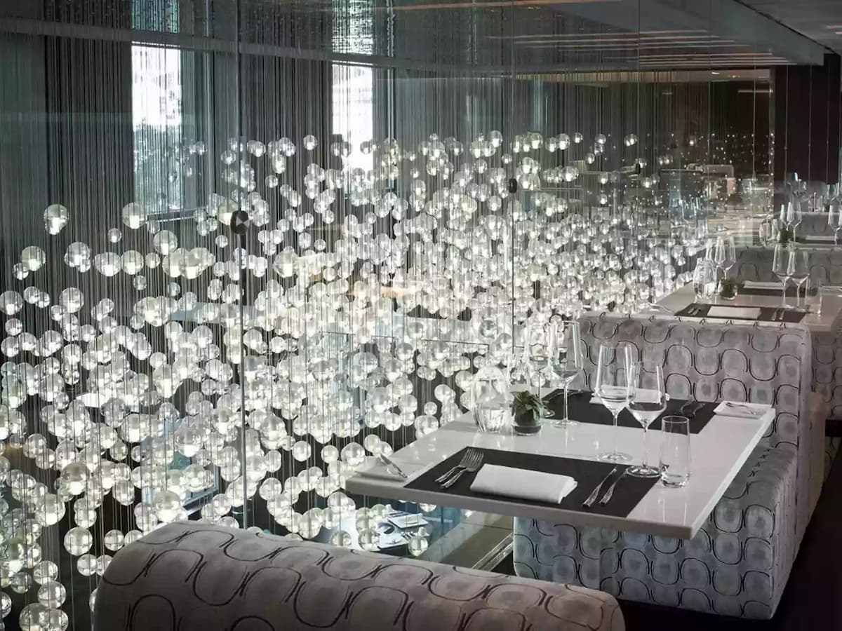 dining area with hanging bulbs view