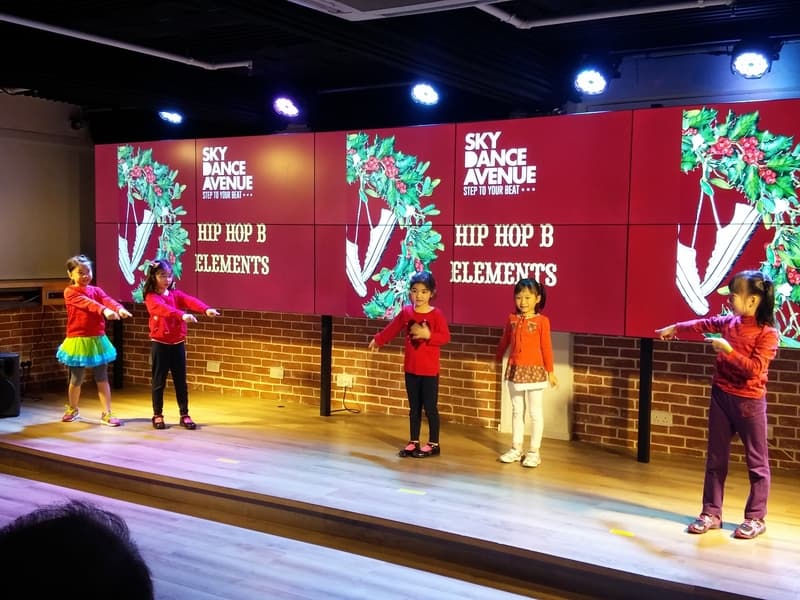 children performing on stage for christmas day