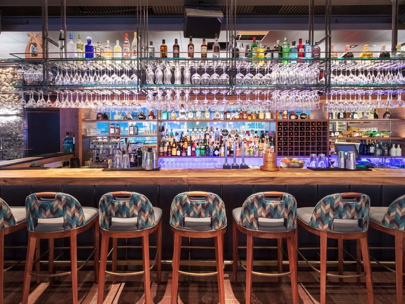 bar area featuring various options of alcohol drinks