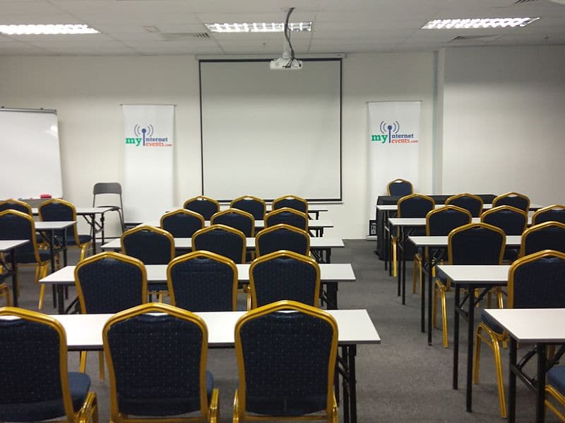minimalist event space for seminar with screen projector