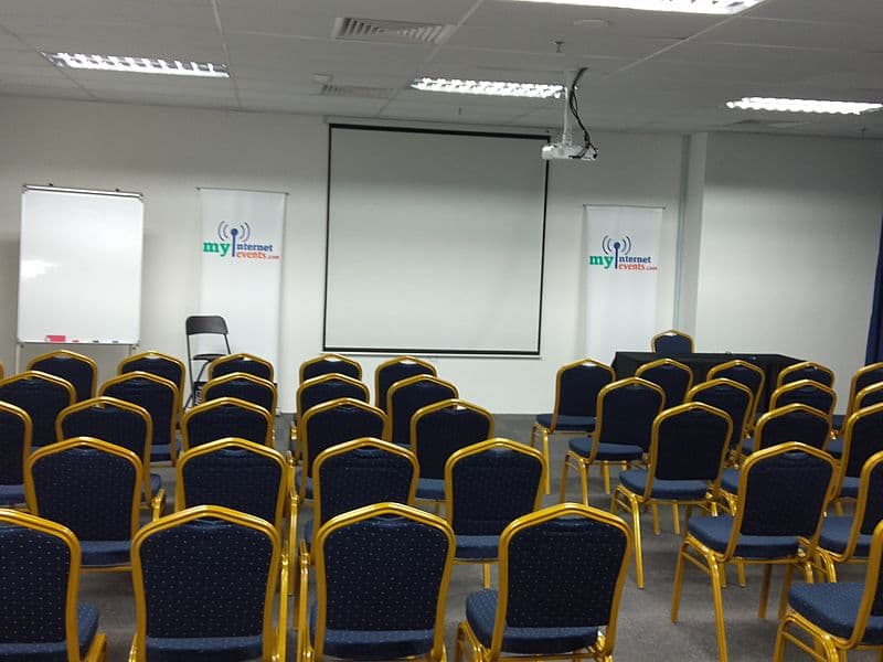 seminar room in kuala lumpur with projector screen and white board