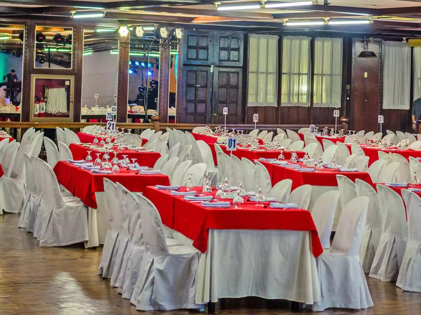 company anniversary party venue in pasig with long dining tables and high ceiling